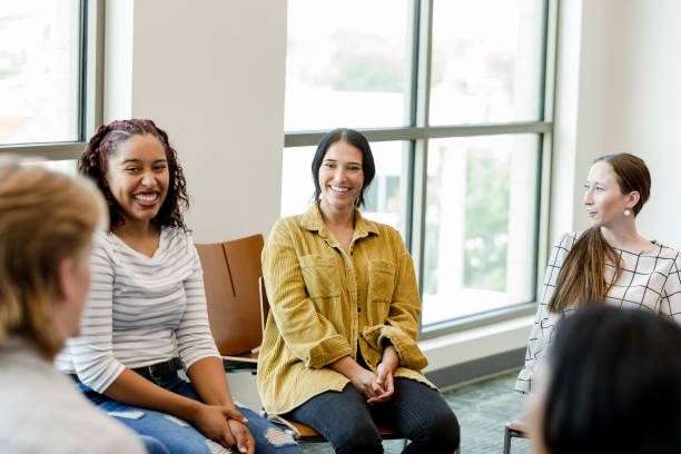 istock Young adults gather for group therapy 1430112969