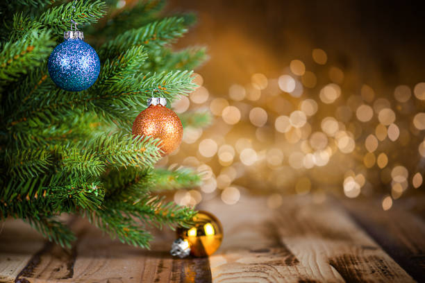 istock Christmas Tree with Ornaments on Wooden Table and Defocused Lights 1430114622