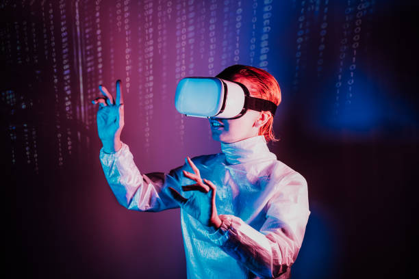 istock Metaverse concept. Woman in holographic clothes and vr glasses on matrix code background, playing video games with virtual reality headset, trying to touch something with hand in pink blue colors 1430115272
