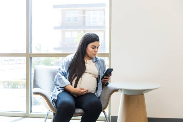 istock Expectant mom surfs net while waiting to see doctor 1430117408