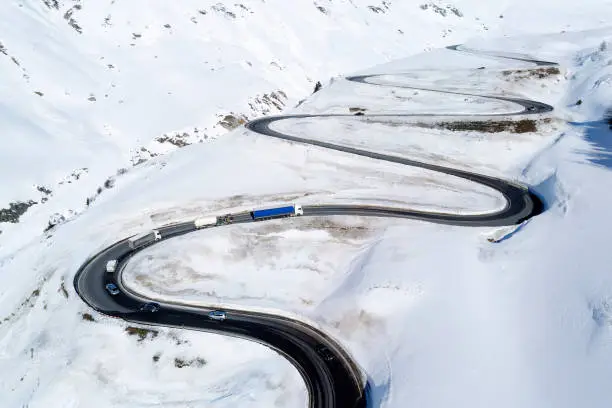 Photo of Traffic on Mountain Road in Winter, Swiss Alps, Aerial View