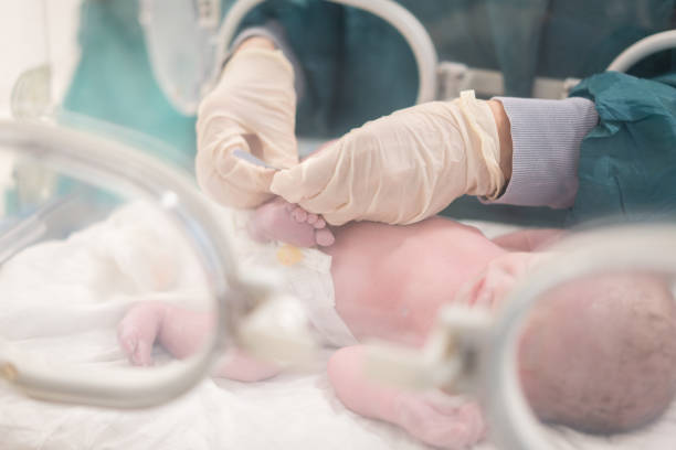 Name tag attached to a newborn's foot postpartum