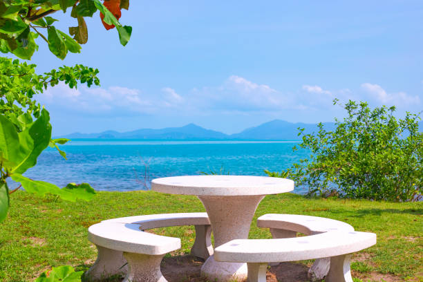 istock Tropical seashore with a table on a picturesque beach on a sunny day. Rest and relaxation 1430122421
