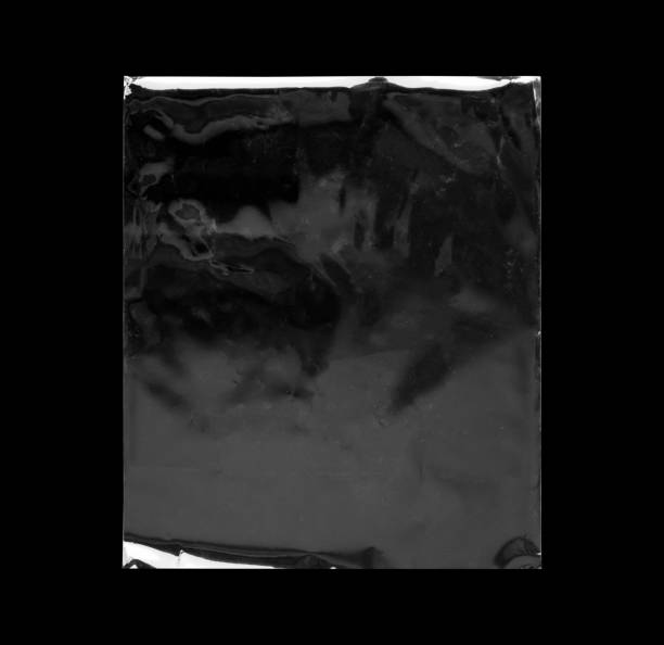 Blank transparent plastic bag overlay on black background