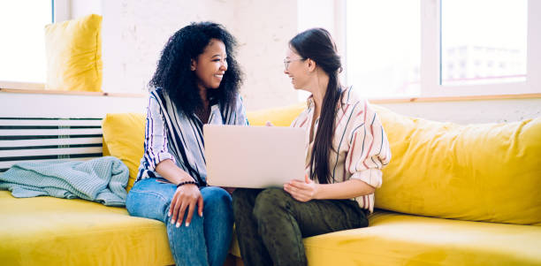 istock Teenagers with laptop looking at each other 1430127902
