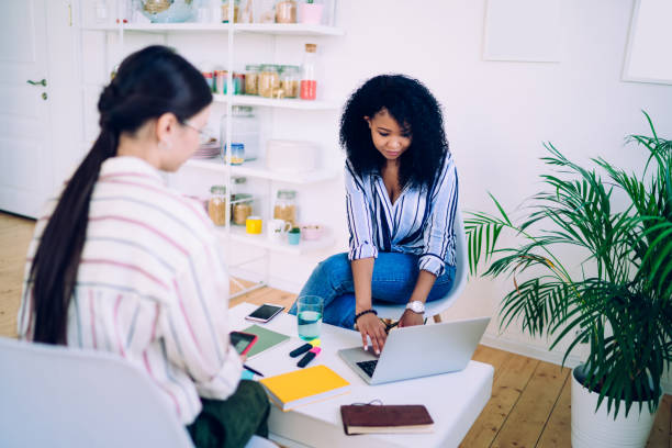 istock Black woman using laptop at meeting 1430128023