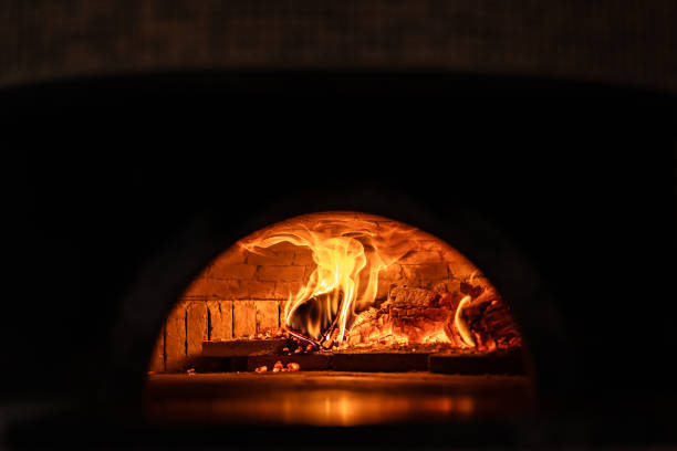 istock Pizza oven burning in flames getting ready to bake pizza 1430129537