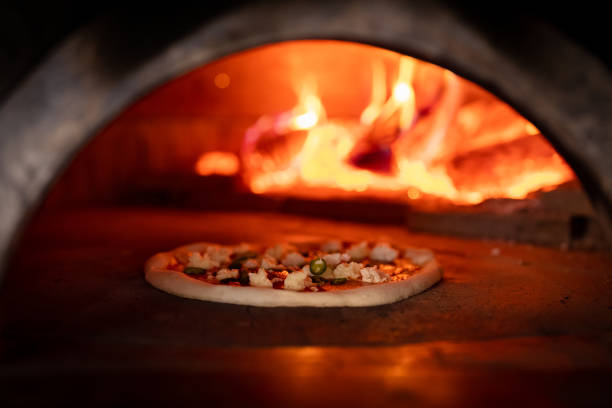 istock Pizza oven burning in flames getting ready to bake pizza 1430129575