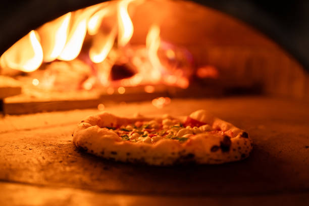 istock Pizza oven burning in flames getting ready to bake pizza 1430129585