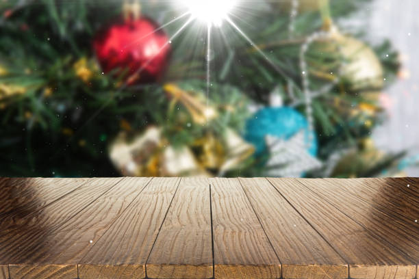 istock Blurred Christmas background with empty wooden table in focus. Empty display for product assembly 1430130594