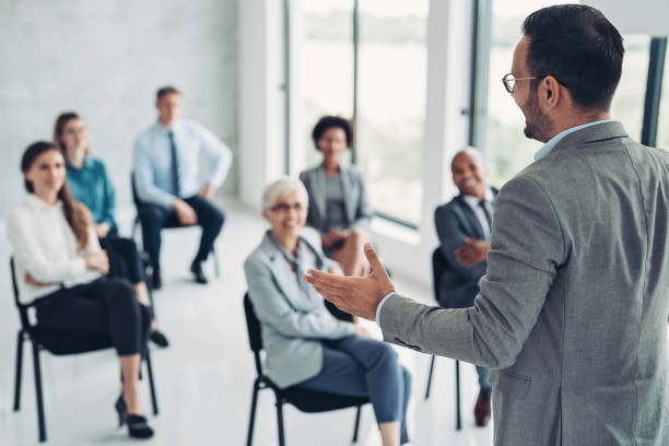 istock Businessman talking to an audience 1430131678