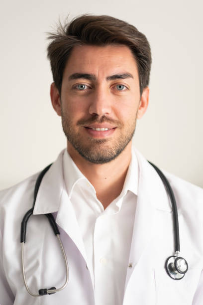 portrait of handsome young doctor stock photo
