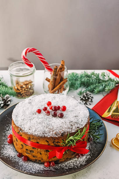 istock Traditional Christmas fruitcake decorated with red ribbon. 1430133606