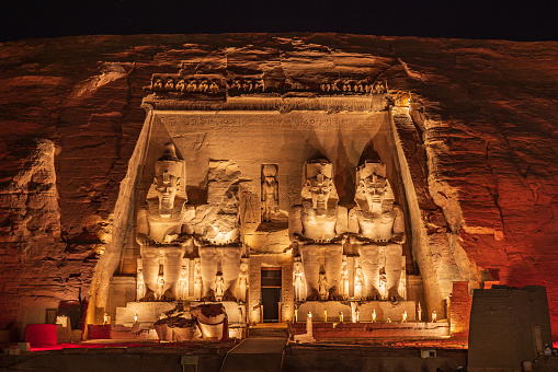Abu Simbel, Aswan, Egypt. February 22, 2022. The colossal statues of the Great Temple of Ramesses II lit up at night.