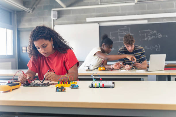 istock Group of students learning electronics and robotics at High School College 1430134720