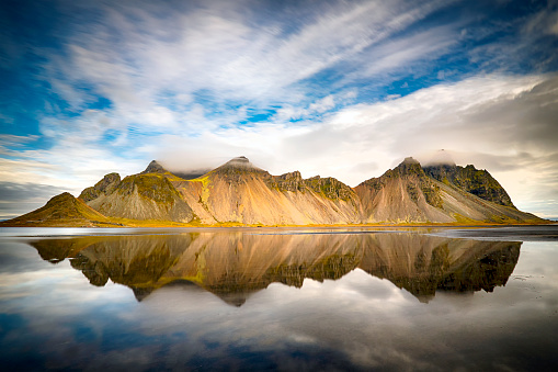 Iconic Vestrahorn massif with reflections in water, Eastern Iceland