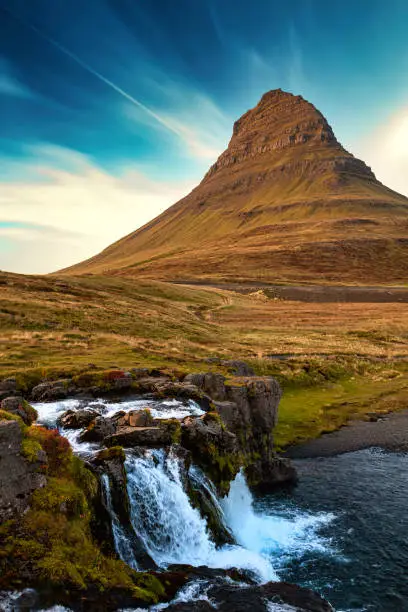 Iconic Kirkjufell mountain in fall at the Snaefellsnes peninsula. Despite Kirkjufell is only 463 m high it is one of the most photographed places in Iceland. This mainly because it was used as location for a lot of movies and series (e.g. Game of Thrones). Kirkjufell lies at Snæfellsnes peninsula, close to the village of Grundarfjörður. Kirkjufell Mountain, Grundarfjordur, Snæfellsnes Peninsula, Northern Iceland, Nordic Countries, Europe.