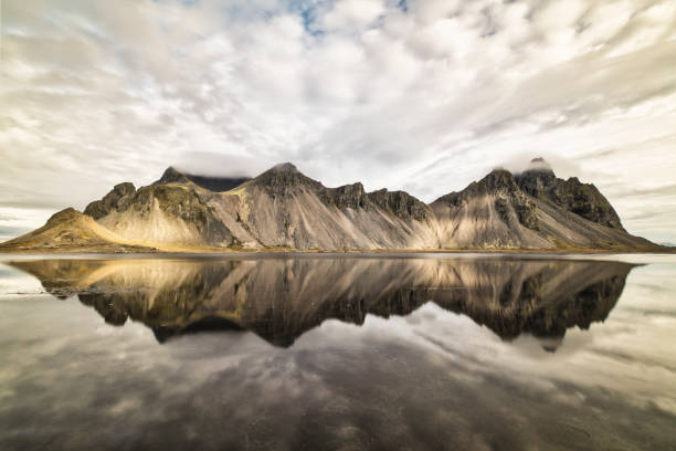 istock Iconic Vestrahorn massif with reflections in water, Eastern Iceland 1430138160