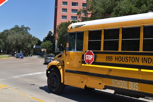 Houston ISD School Bus charter cruising at Hermann Park, Houston TX