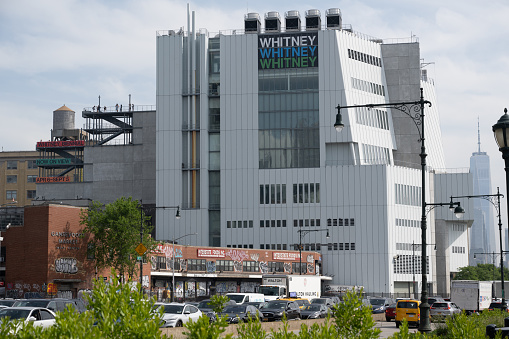 New York, NY, USA - June 3, 2022: The Whitney Museum of American Art. One World Trade Center can be seen in the background.