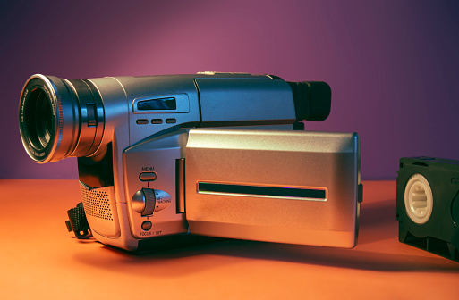 A vintage 90's vhs video camera in 90's color theme.