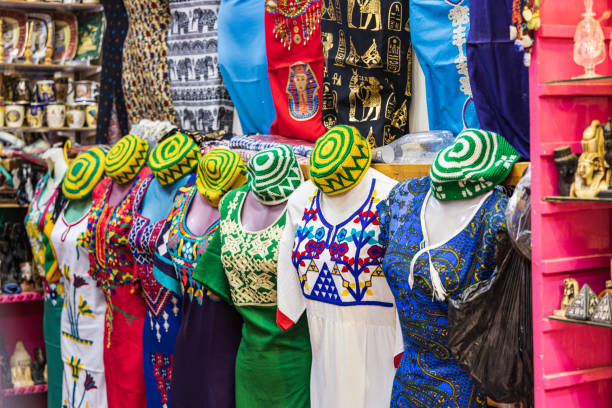 Mexico: Traditional colorful cotton blouses (close-up) on hangers.