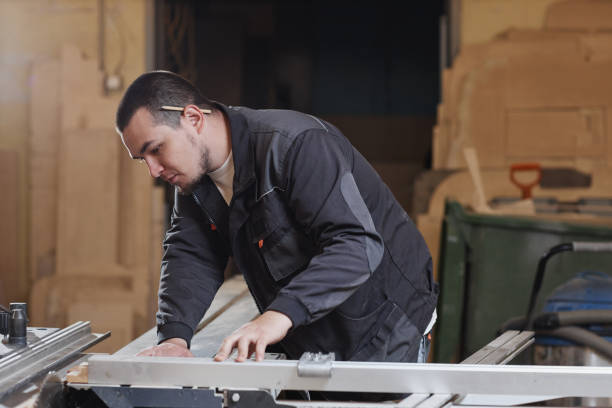 istock Young Worker At Factory Side View 1430147077