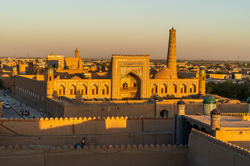 Khiva old town skyline and minarets seen from central tower at sunset