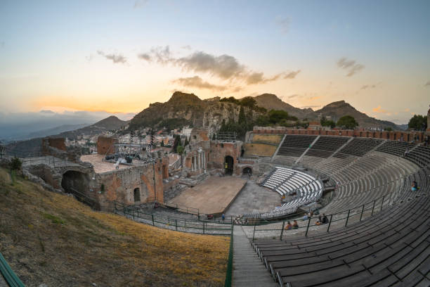 Teatro Greco di Taormina The Greek Theatre of Taormina is the second largest theatre in Sicily, after that of Syracuse. greek amphitheater stock pictures, royalty-free photos & images