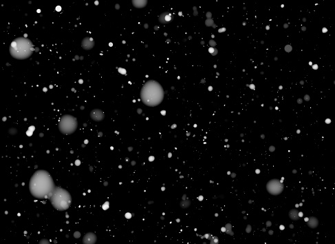it's snowing on a black isolated background