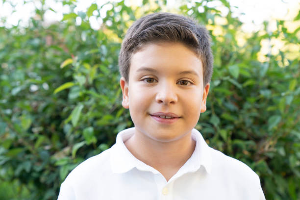 portrait of young boy looking at camera