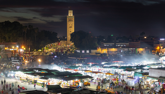MARRAKESH, MOROCCO - NOVEMBER 02, 2021: People in Jemaa el-Fnaa where main square of Marrakesh, used by locals and tourists
