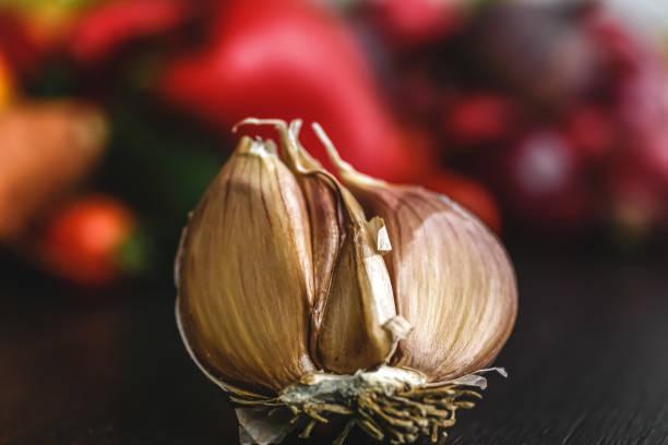 Half of garlic close-up on a blurred background, macro shot.