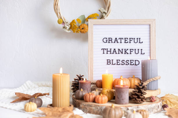 istock Felt letter board and text grateful, thankful, blessed. Autumn table decoration. Floral interior decor for fall holidays with handmade pumpkins 1430155771