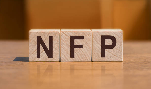 istock Text NFP on wooden cubes on orange background. Abbreviation from Non-farm payrolls 1430161733