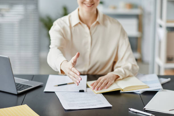 istock Businesswoman Greeting Partner 1430161884