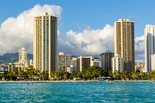 Views of Honolulu from the water off the coast.