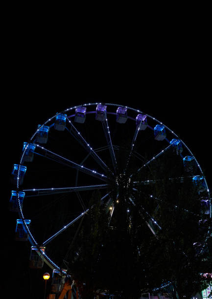 istock vertical shot of ferris wheel lighted up at night 1430162961