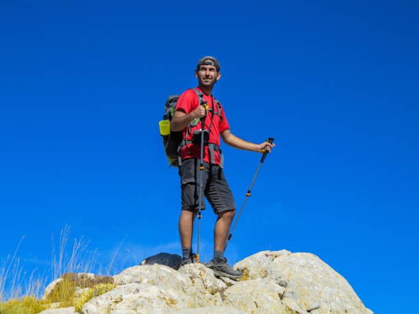 istock Backpacking man enjoying the view at the summit 1430163189