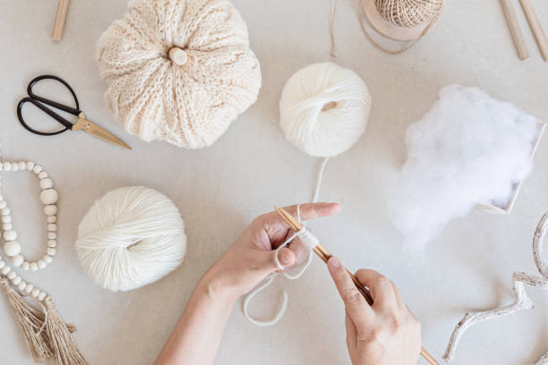 istock Hobby background with handmade knit pumpkins, tools and accessories. DIY, craft decoration for fall and winter holidays. Flat lay, top view 1430163199