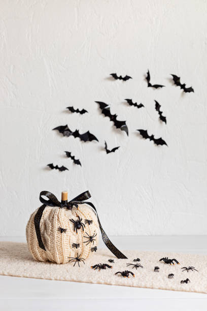 istock Modern interior decoration for halloween celebration with handmade knit pumpkin, spiders, bats 1430163228