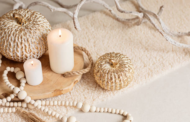 istock Autumn table decoration. Interior decor for fall holidays with handmade pumpkins and candles. Holiday greeting card 1430163278