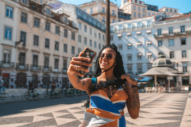 istock Afro woman vlogging outdoors 1430163469
