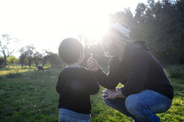 istock father and son enjoying nature 1430163711