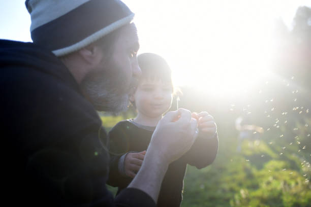 istock father and son enjoying nature 1430164051
