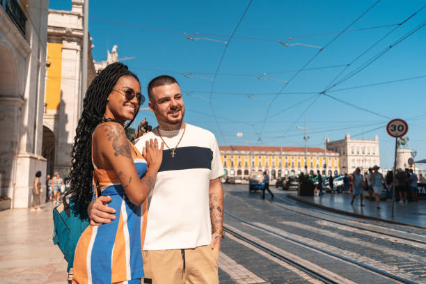 istock Young couple crossing the crosswalk 1430165215