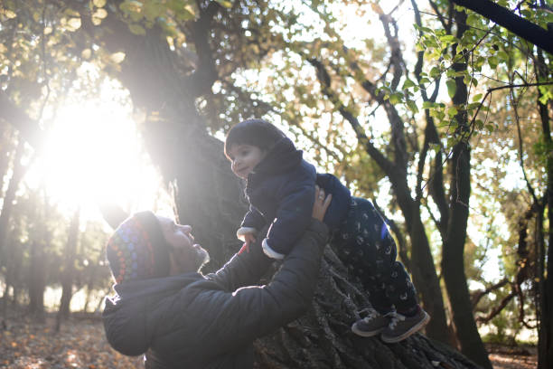 istock father and child among the trees 1430171239