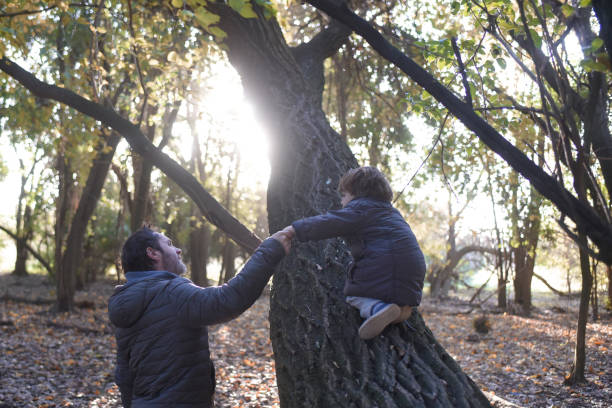 istock father and child among the trees 1430171339