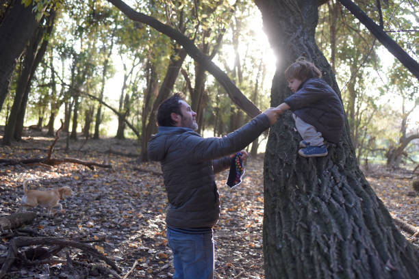 istock father and child among the trees 1430171357
