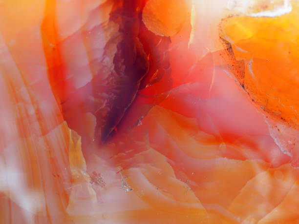 Macro Shot of a Large Carnelian Crystal Heart Close up with light shining through a Carnelian Crystal Heart - Abstract Carnelian Layers phallus shaped stock pictures, royalty-free photos & images
